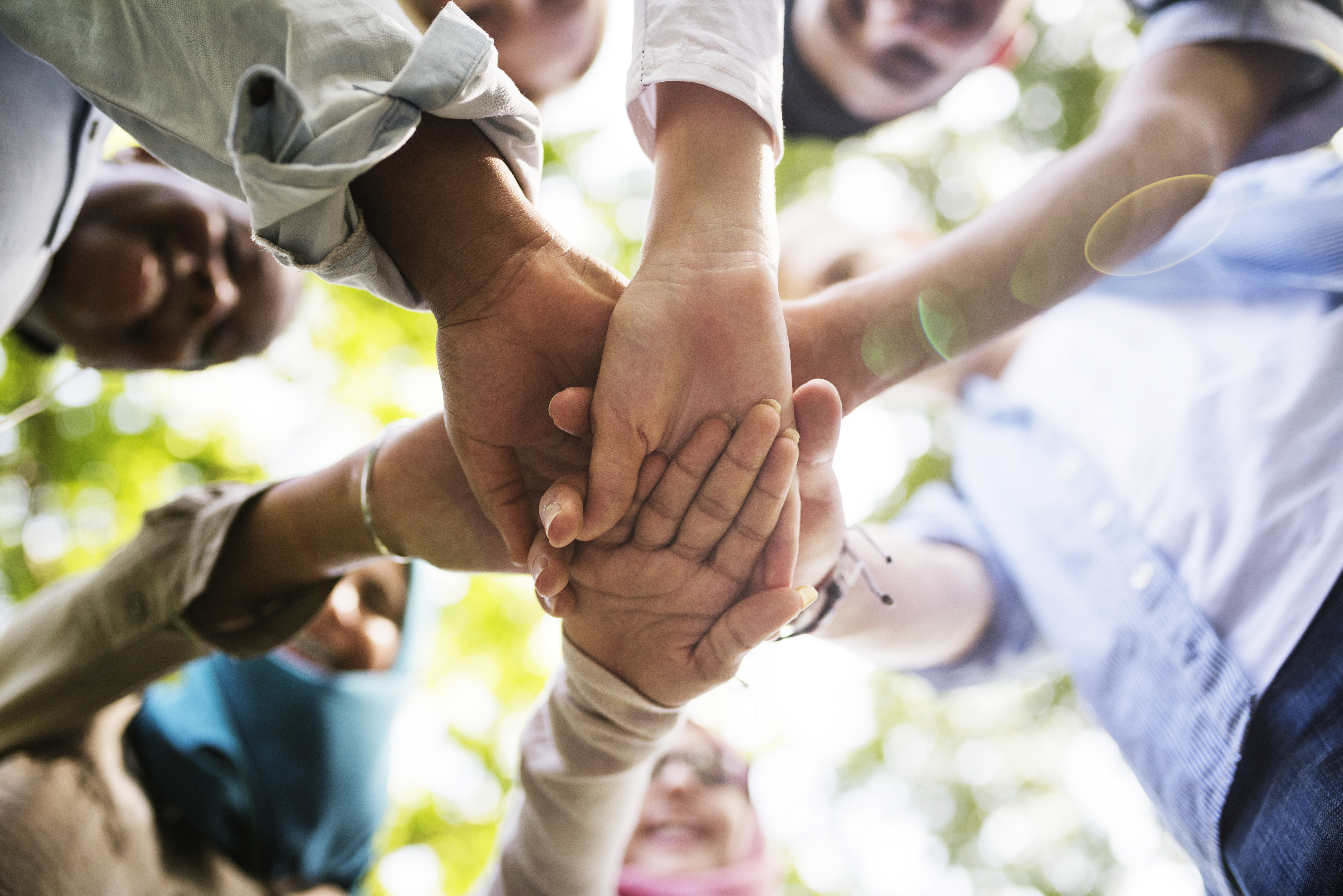 group-of-diverse-youth-hands-joined-2022-12-16-01-17-37-utc